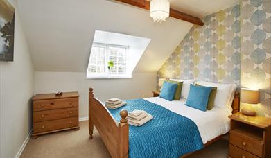 An image of a double bedroom at Smugglers Rock Cottages
