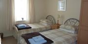 An image of a twin room at Whitehall Landing Apartment - Owners Cottages