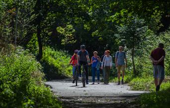 An image of walkers on The Cinder Track