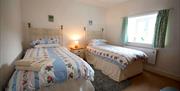 An image of a twin room at Chain Bridge Cottage - Owners Cottages