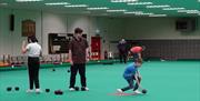 image of people bowling at bowls centre