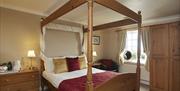 An image of Smugglers Rock Country House four poster bedroom
