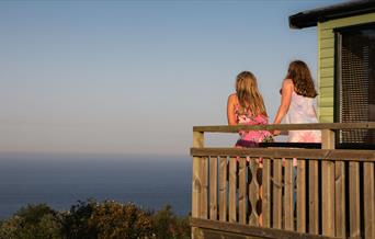 An image of some people enjoying the view out to sea from Northcliffe & Seaview Holiday Park