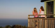 An image of some people enjoying the view out to sea from Northcliffe & Seaview Holiday Park