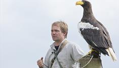 An image of National Centre for Birds of Prey Director Charlie Heap with Stellers Sea Eagle