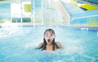 An image of girl in swimmer pool under water feature at Primrose Valley Holiday Park