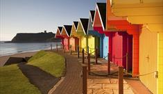 An image of multicoloured huts at Scarborough North Bay