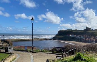 An image of Whitby from The Whale Bone Arch looking over the sea and Whitby Abbey