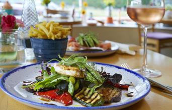 An image of The Yew Tree Cafe and Bistro - plate of food and glass of wine